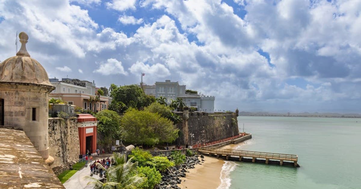 Explore the scenic view of Old San Juan's historic coastal fortifications by the sea.