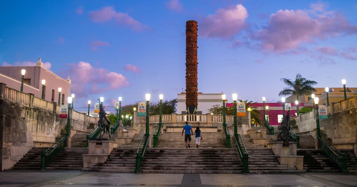 Scenic evening view of Totem Square with vibrant sky in Old San Juan, Puerto Rico.